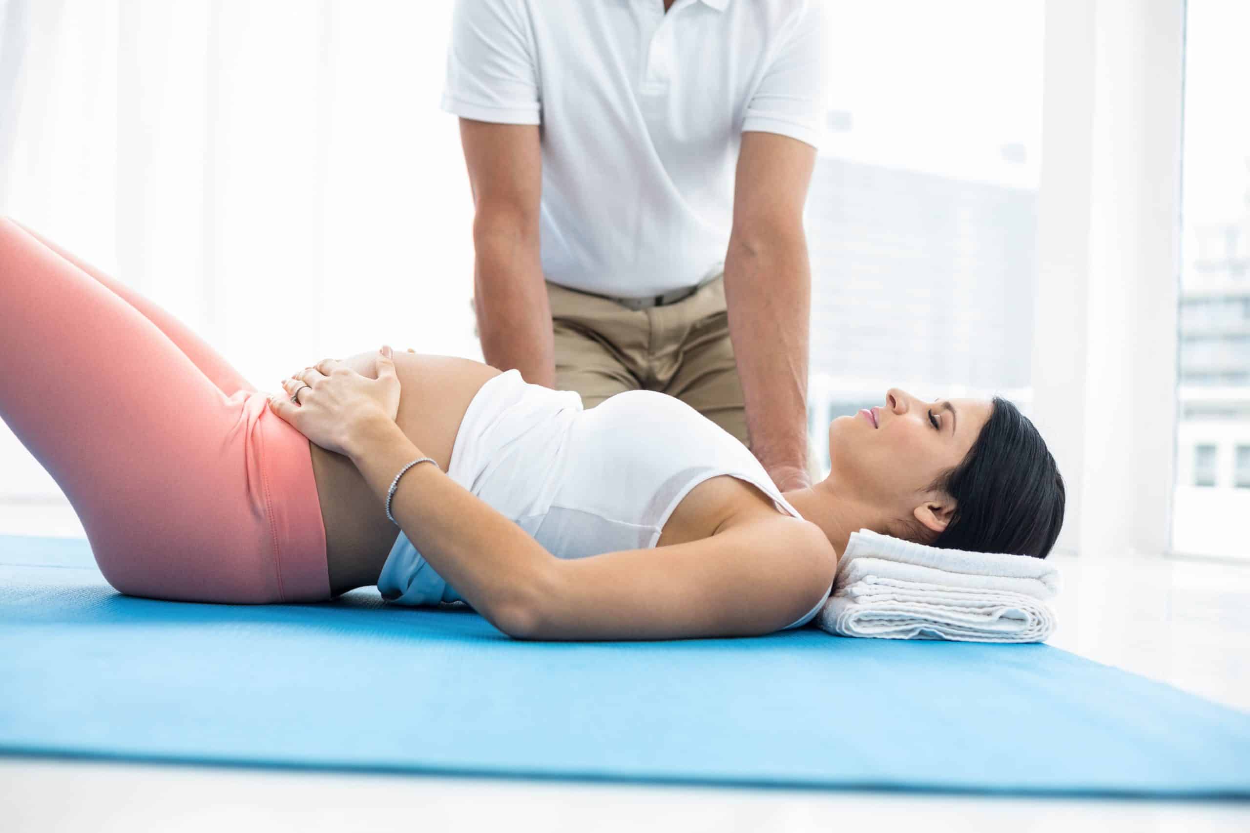 Pregnancy chiropractor treating a patient.