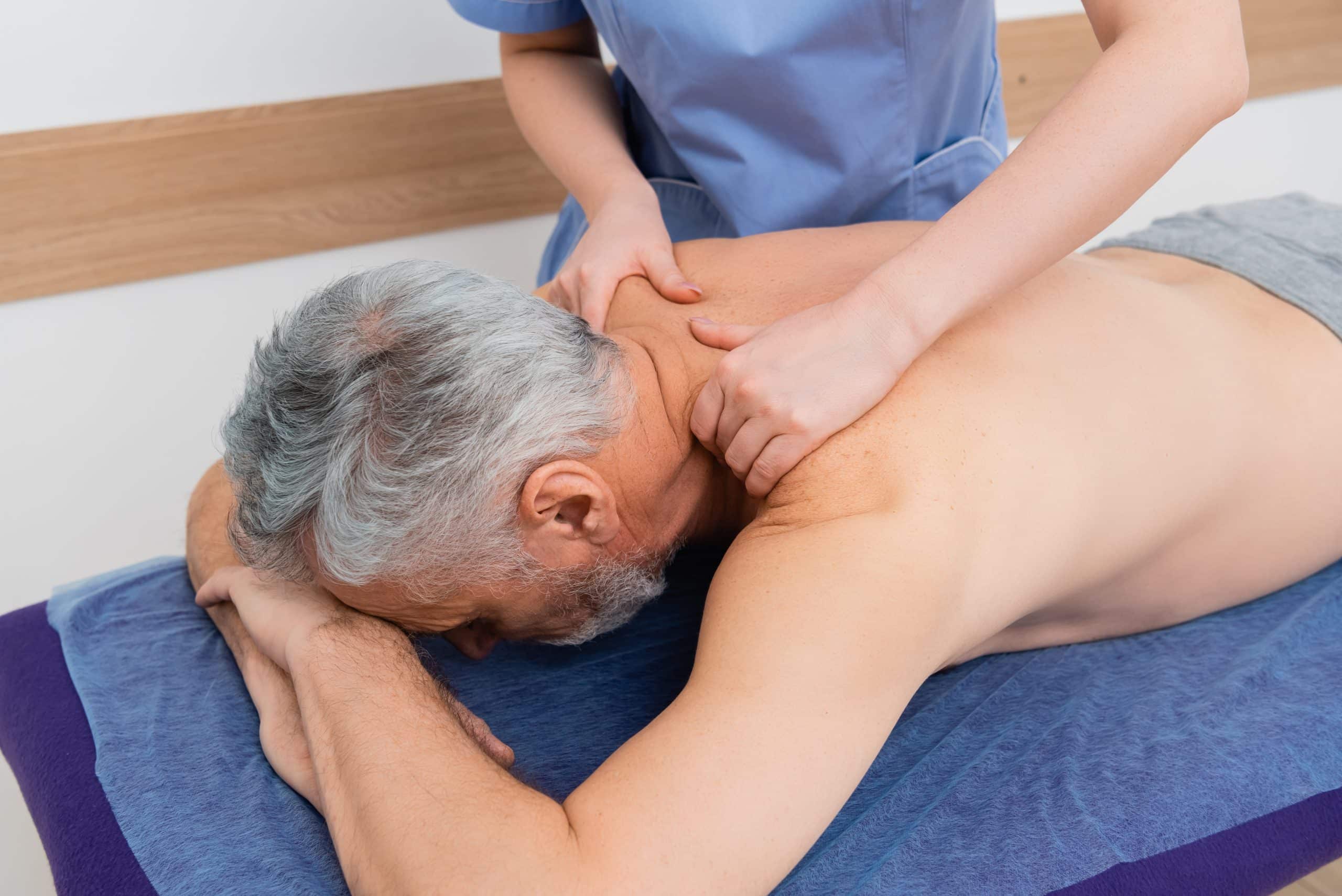 Man receiving medical massage therapy.